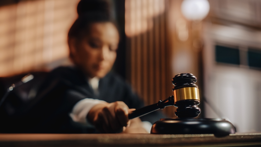 Out of focus judge with gavel